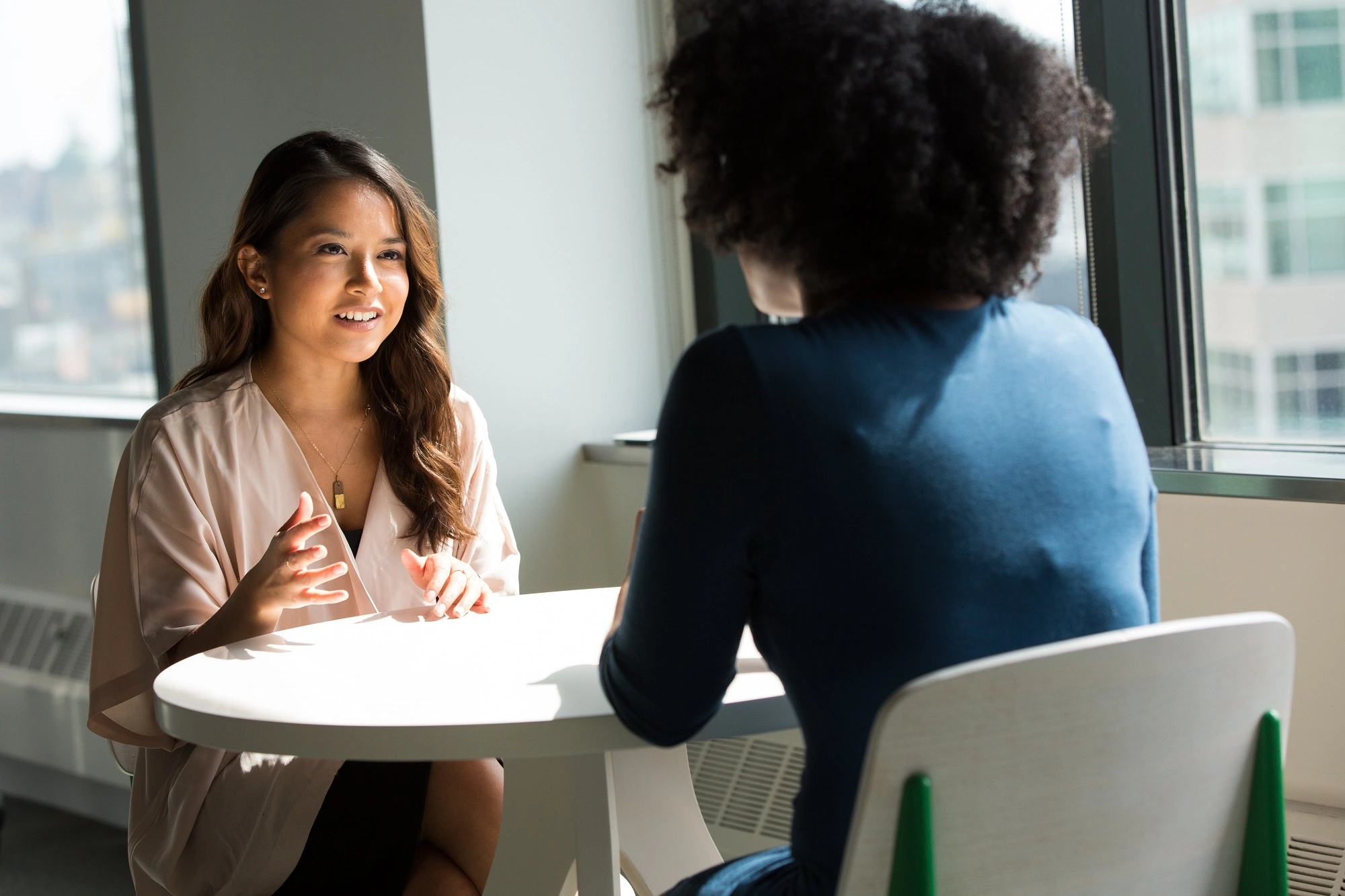 Two professionals meeting in an office, representing career seekers connecting with apprenticeship opportunities through Workforce Solutions Capital Area